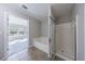 Bathroom features a bathtub, separate glass-enclosed shower, and an attached bedroom at 2873 Snapfinger Mnr, Decatur, GA 30035