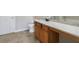 Bathroom features a wood vanity, a white countertop, tile floors, and neutral walls at 2873 Snapfinger Mnr, Decatur, GA 30035