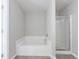 Bathroom features a white bathtub with a shower and a glass-enclosed shower at 2873 Snapfinger Mnr, Decatur, GA 30035