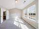 Bright bedroom with neutral walls and carpet features an ensuite bathroom and plenty of natural light at 2873 Snapfinger Mnr, Decatur, GA 30035