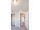 Bright bedroom features neutral paint, carpet floors, and an open door leading to the hallway at 2873 Snapfinger Mnr, Decatur, GA 30035