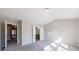 Spacious bedroom features an ensuite bathroom, grey carpet, neutral walls, and lots of natural light at 2873 Snapfinger Mnr, Decatur, GA 30035