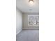Bedroom with neutral walls, carpeted floor, and natural light from a large window at 2873 Snapfinger Mnr, Decatur, GA 30035