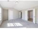 Large bedroom features an ensuite bathroom, neutral walls, grey carpet, and plenty of natural light at 2873 Snapfinger Mnr, Decatur, GA 30035