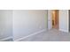 Bedroom features neutral walls, carpeted floors, and a door leading to another room at 2873 Snapfinger Mnr, Decatur, GA 30035