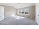 Bright bedroom with carpeted floors, a vaulted ceiling, and abundant natural light from several windows at 2873 Snapfinger Mnr, Decatur, GA 30035