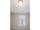 Neutrally painted bedroom with a window with mini blinds allowing for plenty of natural light at 2873 Snapfinger Mnr, Decatur, GA 30035