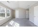Bright bedroom with neutral walls and grey carpet features two windows and lots of natural light at 2873 Snapfinger Mnr, Decatur, GA 30035