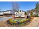 Welcoming entrance to Snapfinger Manor with colorful flower beds and manicured landscaping at 2873 Snapfinger Mnr, Decatur, GA 30035