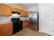Bright kitchen showcasing wood cabinets and a stainless steel refrigerator, perfect for cooking at 2873 Snapfinger Mnr, Decatur, GA 30035