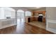 Spacious kitchen with black appliances and wood cabinets seamlessly connected to the living area at 2873 Snapfinger Mnr, Decatur, GA 30035