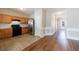 Well-lit kitchen featuring wood cabinets and stainless steel refrigerator, leading to the foyer at 2873 Snapfinger Mnr, Decatur, GA 30035