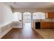 Open-concept kitchen with wood floors, and dark appliances at 2873 Snapfinger Mnr, Decatur, GA 30035