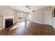 Features a cozy living room with hardwood floors, a fireplace, and a glass panel back door at 2873 Snapfinger Mnr, Decatur, GA 30035