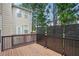 Back deck of home is surrounded by trees for privacy at 11302 Musette Cir, Alpharetta, GA 30009