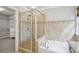 Elegant bathroom with a glass-enclosed shower and tub combination at 11302 Musette Cir, Alpharetta, GA 30009