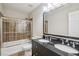 Bathroom featuring a shower over tub with and sinks at 11302 Musette Cir, Alpharetta, GA 30009