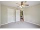 Empty bedroom offering great lighting, clean carpet and plenty of space at 11302 Musette Cir, Alpharetta, GA 30009
