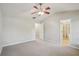 Spacious bedroom with neutral carpet and ensuite bathroom at 11302 Musette Cir, Alpharetta, GA 30009