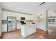 Modern kitchen featuring stainless steel appliances, an island, recessed lighting and wood floors at 11302 Musette Cir, Alpharetta, GA 30009