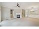 Comfortable living room with a fireplace, neutral walls, carpet and recessed lighting at 11302 Musette Cir, Alpharetta, GA 30009