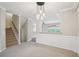 Spacious living room featuring stairs to the second floor and views into the kitchen at 11302 Musette Cir, Alpharetta, GA 30009