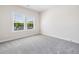 Neutral bedroom with large windows and plush carpet at 117 Villanueva Rd, Woodstock, GA 30188
