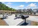 Community grilling area with tables and seating, providing a perfect spot for outdoor cookouts and gatherings at 117 Villanueva Rd, Woodstock, GA 30188