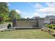 The welcoming entrance to Easley, featuring attractive signage and landscaping for a great first impression at 117 Villanueva Rd, Woodstock, GA 30188