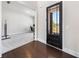 Open foyer with hardwood floors and a view into an office space, showcasing a modern interior design at 117 Villanueva Rd, Woodstock, GA 30188