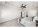 Spacious bedroom with ceiling fan, plush carpet, and ensuite bathroom at 117 Villanueva Rd, Woodstock, GA 30188