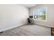 Bright office space with natural light, featuring a modern desk and a comfortable chair at 117 Villanueva Rd, Woodstock, GA 30188
