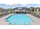 A sparkling swimming pool with lounge chairs for residents, offering a refreshing retreat in the community at 117 Villanueva Rd, Woodstock, GA 30188