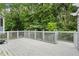 Large back deck offers ample space for outdoor entertaining with a private wooded backdrop at 2311 Sims Ne Dr, Marietta, GA 30066