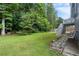 Lush, green backyard featuring mature trees and a stairway leading to a deck at 2311 Sims Ne Dr, Marietta, GA 30066