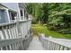View from deck of backyard showcasing mature trees and lush landscaping creating a private oasis at 2311 Sims Ne Dr, Marietta, GA 30066