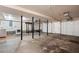 Spacious basement area with utility hookups and garage access presents a versatile space at 2311 Sims Ne Dr, Marietta, GA 30066