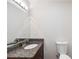 Bathroom featuring granite countertop vanity and toilet at 2311 Sims Ne Dr, Marietta, GA 30066