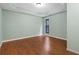 Bright bedroom boasts wood floors, modern lighting, and a tray ceiling for added appeal at 2311 Sims Ne Dr, Marietta, GA 30066