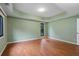 Neutral bedroom featuring hardwood floors, and large windows providing ample natural light at 2311 Sims Ne Dr, Marietta, GA 30066