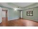 Large bedroom featuring hardwood floors, neutral paint, and large windows offering ample natural light at 2311 Sims Ne Dr, Marietta, GA 30066