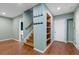 Welcoming entryway features wood floors, a staircase, and a convenient built-in storage area at 2311 Sims Ne Dr, Marietta, GA 30066