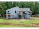 Charming blue two-story home with a wooden pergola and lush green yard at 2311 Sims Ne Dr, Marietta, GA 30066