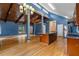 Open concept kitchen with blue walls, wood cabinets, stainless appliances, and hardwood floors at 2311 Sims Ne Dr, Marietta, GA 30066