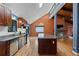 Open-concept kitchen flows into a living area, with a large center island and hardwood floors at 2311 Sims Ne Dr, Marietta, GA 30066