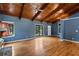 Spacious living room with hardwood floors, wood-beamed ceiling and natural light from the sliding doors at 2311 Sims Ne Dr, Marietta, GA 30066