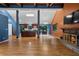 Bright, open-concept living area with hardwood floors and a stone fireplace at 2311 Sims Ne Dr, Marietta, GA 30066