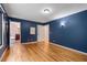 Main bedroom with hardwood floors, access to the bathroom, and plenty of space at 2311 Sims Ne Dr, Marietta, GA 30066