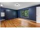 Spacious main bedroom features blue built-in storage, hardwood floors and a large window at 2311 Sims Ne Dr, Marietta, GA 30066