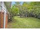 View of the backyard with lush greenery and mature trees, offering a private outdoor space at 2785 Toney Dr, Decatur, GA 30032